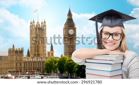 education, school, knowledge and people concept - picture of happy student girl or woman in trencher cap with stack of books over houses of parliament in london city background