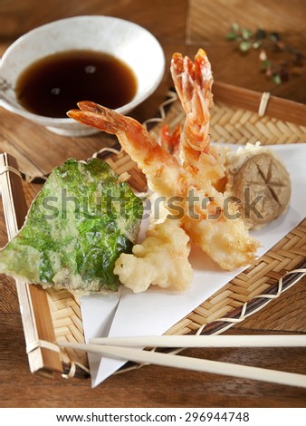 Shrimp tempura, deep fried shrimp served in basket, vertical photo