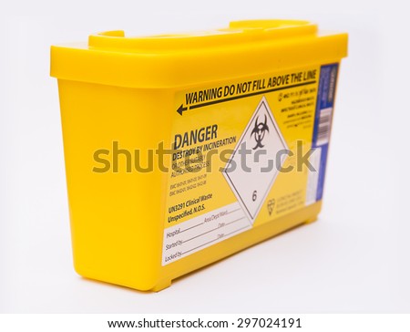 Medical or clinical sharps yellow waste container Royalty-Free Stock Photo #297024191