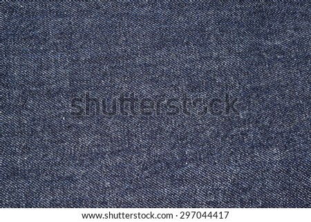 Blue Jeans Denim, 100% Cotton Un sanforized Denim Red Selvage Jeans on Plaid Shirt background, selective focus (detailed close-up shot) Royalty-Free Stock Photo #297044417