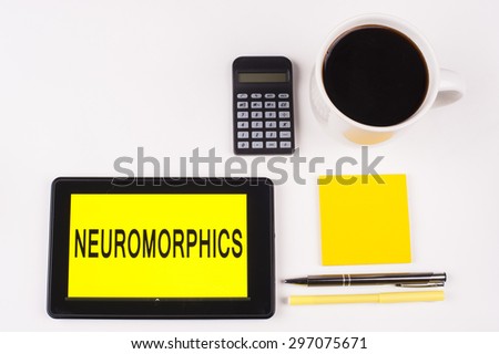 Business Term / Business Phrase on Tablet PC with a cup of coffee, Pens, Calculator, and yellow note pad on a White Background - Black Word(s) on a yellow background - Neuromorphics