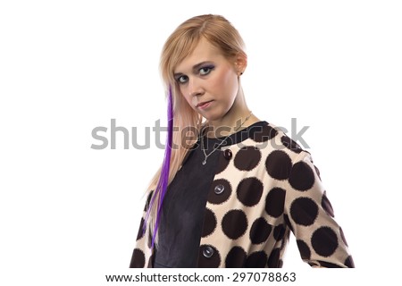 Portrait of woman in spotted coat on white background