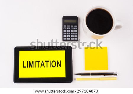 Business Term / Business Phrase on Tablet PC with a cup of coffee, Pens, Calculator, yellow note pad White background - Black Word(s) yellow background - Limitation