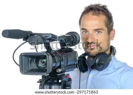 Young man with professional movie camera on white background
