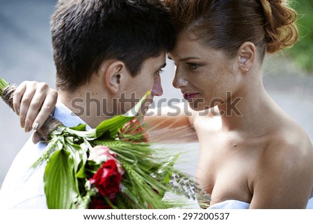 a Red-haired brunette bride and groom beautiful couple
