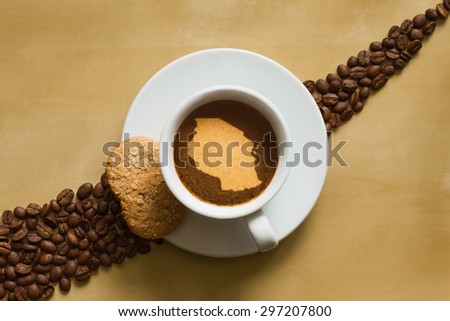 Still life photography of hot coffee beverage with map of Tanzania