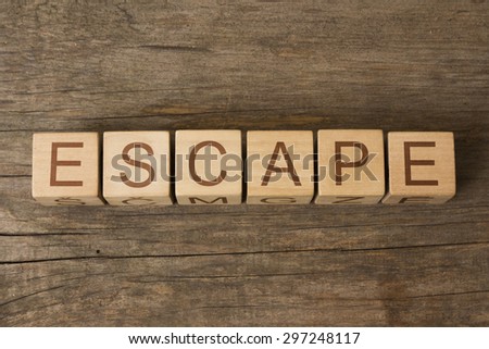 word escape on wooden cubes