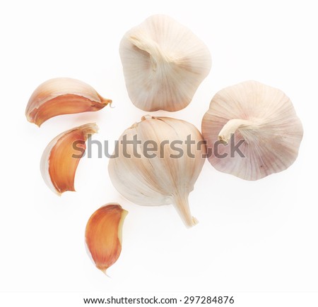 Garlic top view on white background. Royalty-Free Stock Photo #297284876
