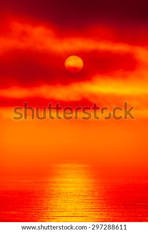 red alien sunset over an ocean