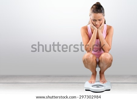 Dieting, Women, Weight Scale. Royalty-Free Stock Photo #297302984