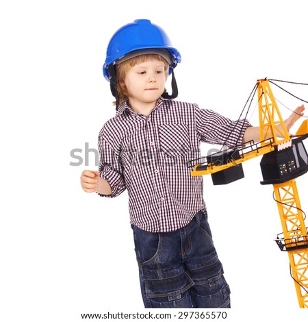 cute handsome little child playing a builder
