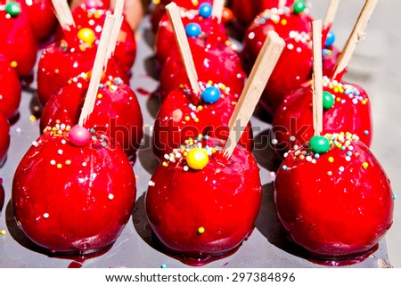 Colorful candy apples for sale at a market