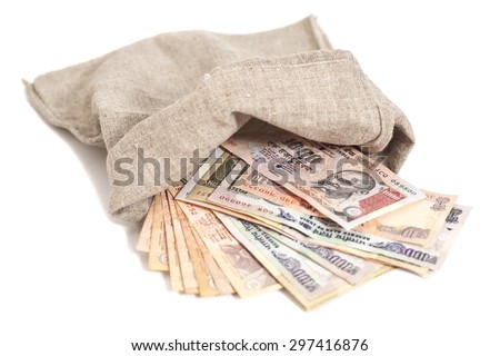Money bag with Indian Currency Rupee bank notes on white background Royalty-Free Stock Photo #297416876