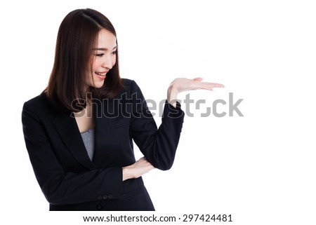 Asian Business woman pointing or presenting to copyspace, with empty palm hand, on white background