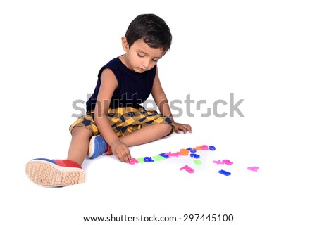 Kid Playing with Alphabets
