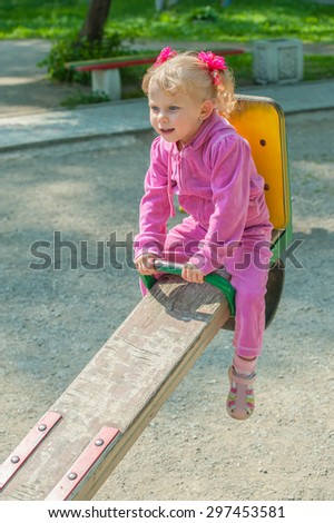 Photo of a little girl playing in the Park
