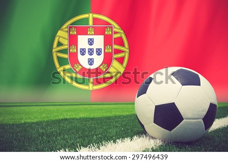 soccer ball in front of the Portugal flag vintage color