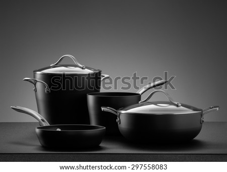 close up view of nice cookware set on grey color back Royalty-Free Stock Photo #297558083