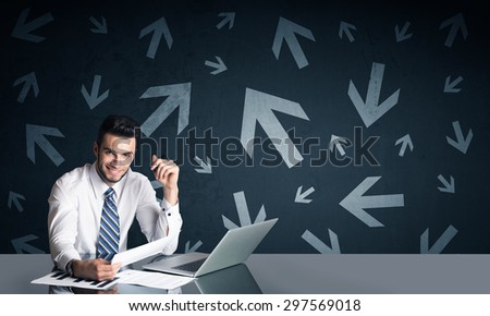 Successful businessman with arrows in background 