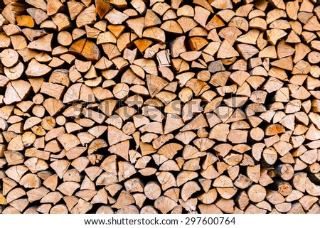 Chopped wooden logs stacked in the woodpile