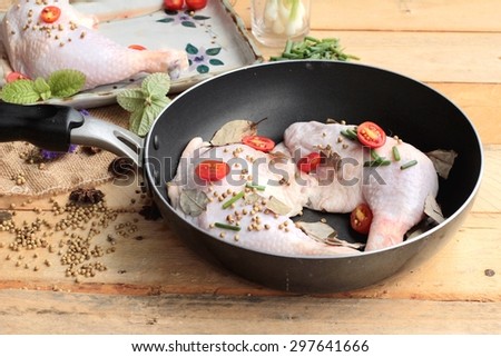 Fresh chicken and tomatoes with spices for cooking