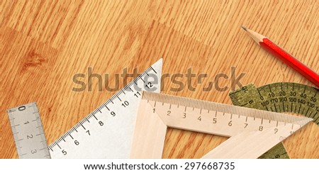 Drafting tools with red pencil in closeup