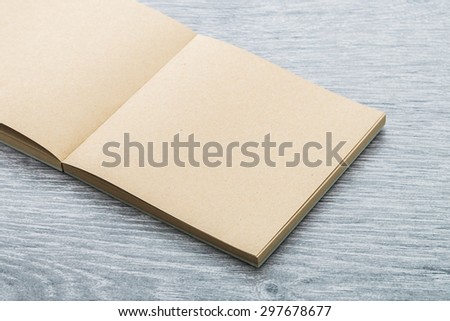 Blank notebook mock up on wood background