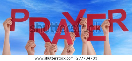 Many Caucasian People And Hands Holding Red Letters Or Characters Building The English Word Prayer On Blue Sky