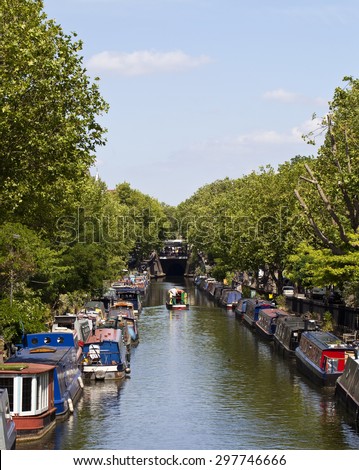 Little Venice in London
In Maida Vale two canals join and form a basin that is known as Little Venice. Here people have made a home living on narrow boats. The canals are still in operation. Royalty-Free Stock Photo #297746666