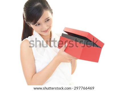 smiling woman with red box