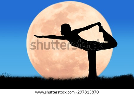 Silhouette young woman practicing yoga on full moon background