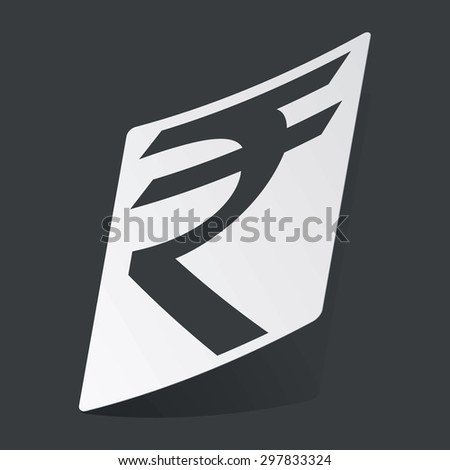 White sticker with black Indian rupee symbol, on black background