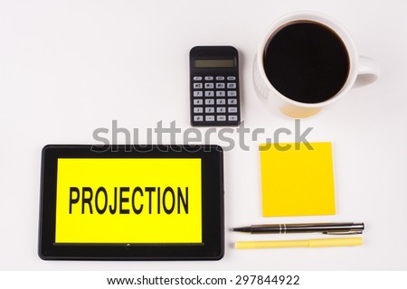 Business Term / Business Phrase on Tablet PC with a cup of coffee, Pens, Calculator, and yellow note pad on a White Background - Black Word(s) on a yellow background - Projection