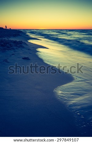 Vintage photo of beautiful after sunset landscape of Baltic Sea shore photographed in Poland. Baltic sea shore.
