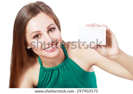 A beautiful woman holds out a business or credit card Isolated on white background