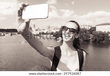 Happy beautiful girl taking a selfie. 