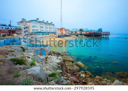 Beach & Building on Cannery Row in Monterey, California, USA Royalty-Free Stock Photo #297928595