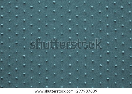 texture of fine knitted fabric of turquoise color with small fluffy blond specks for abstract backgrounds