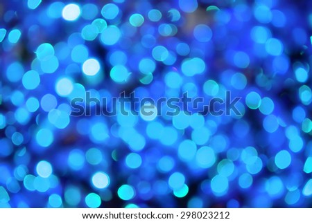 Blue bokeh defocused lights background. Festive Christmas background 