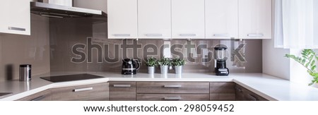 Picture of beige and white kitchen design
