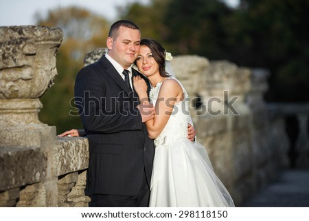 Amazing happy gentle stylish beautiful romantic caucasian couple on the background ancient baroque castle, Lviv