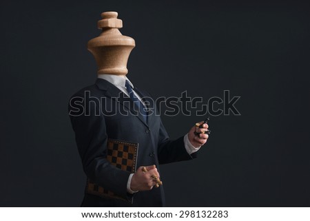 Symbol of a Headless Narcissist with pawns in the hands Royalty-Free Stock Photo #298132283