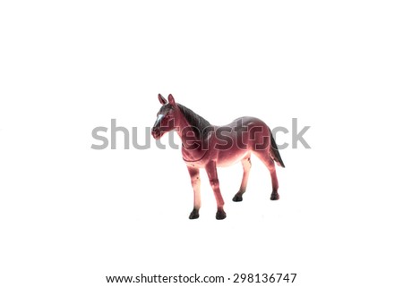 Dark brown horse toy. Isolated dark brown horse toy standing on white background profile and angle view.