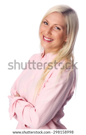 A cute woman with blonde hair in her 20s, standing against a white background in a pink shirt feeling great and confident.