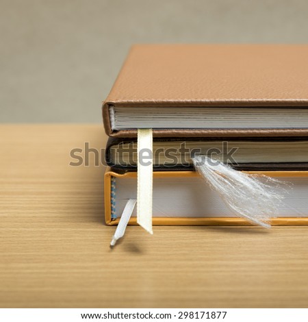 stack of book on wood background