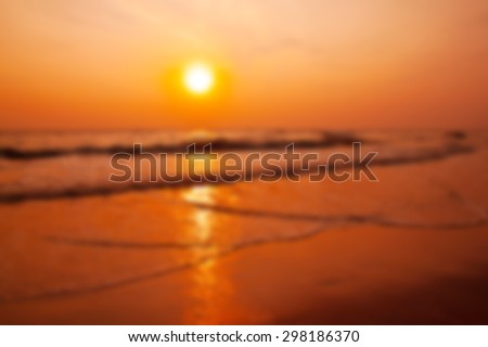 Sunset beach and blured filter effect.