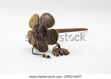 wooden hair pin on white background