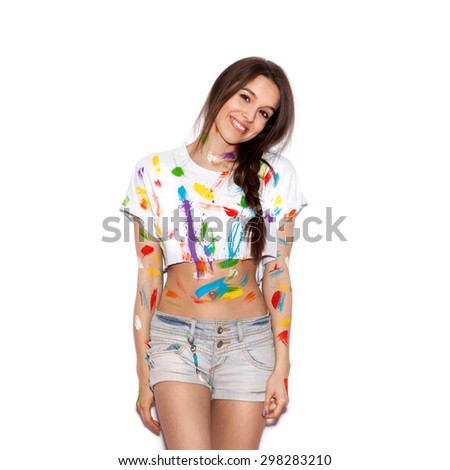 Young cheerful soiled in paint girl having fun. Smiling Woman with bright makeup and hairstyle on White background not isolated
