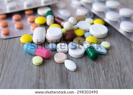 Packaging of tablets and pills on the table. Medicine Royalty-Free Stock Photo #298303490