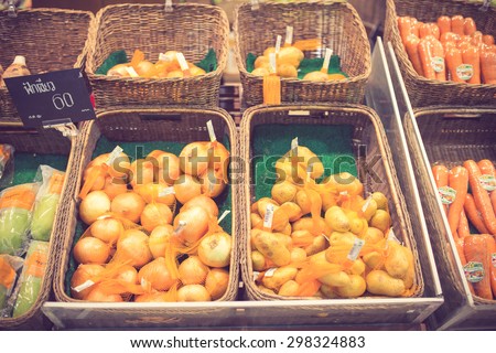 Vegetables on stall in a supermarket vintage color